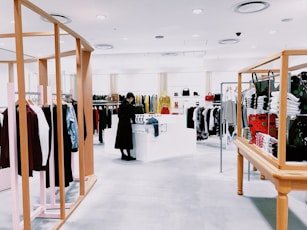 woman standing inside clothing area