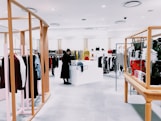 woman standing inside clothing area