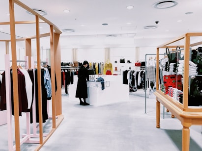 woman standing inside clothing area