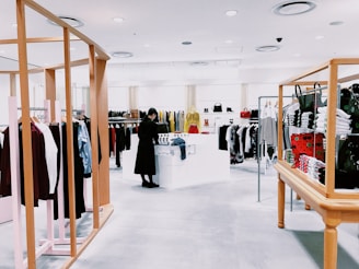 woman standing inside clothing area