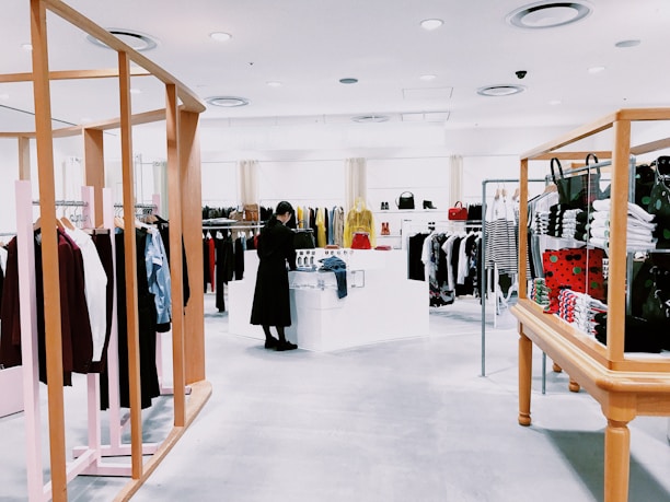 woman standing inside clothing area