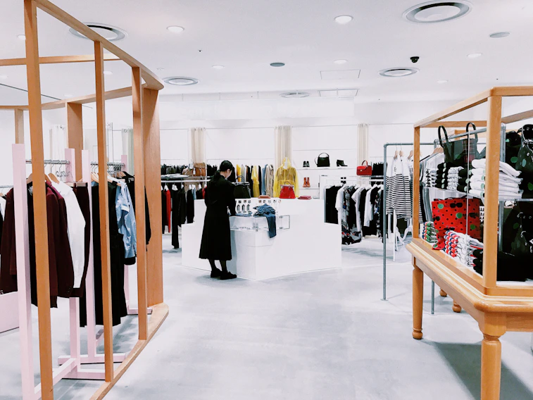 woman standing inside clothing area