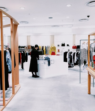 woman standing inside clothing area