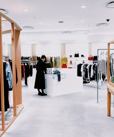 woman standing inside clothing area