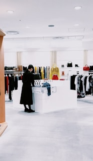 woman standing inside clothing area