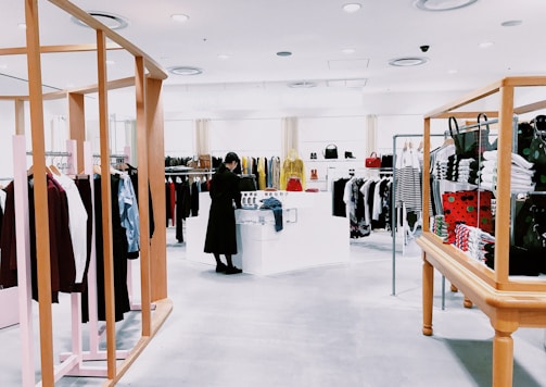 woman standing inside clothing area