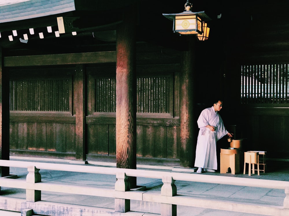 man standing outside temple