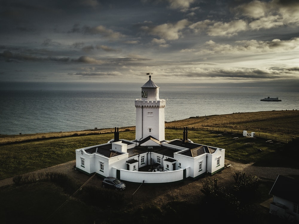 aerial photo of lighthouse near sea