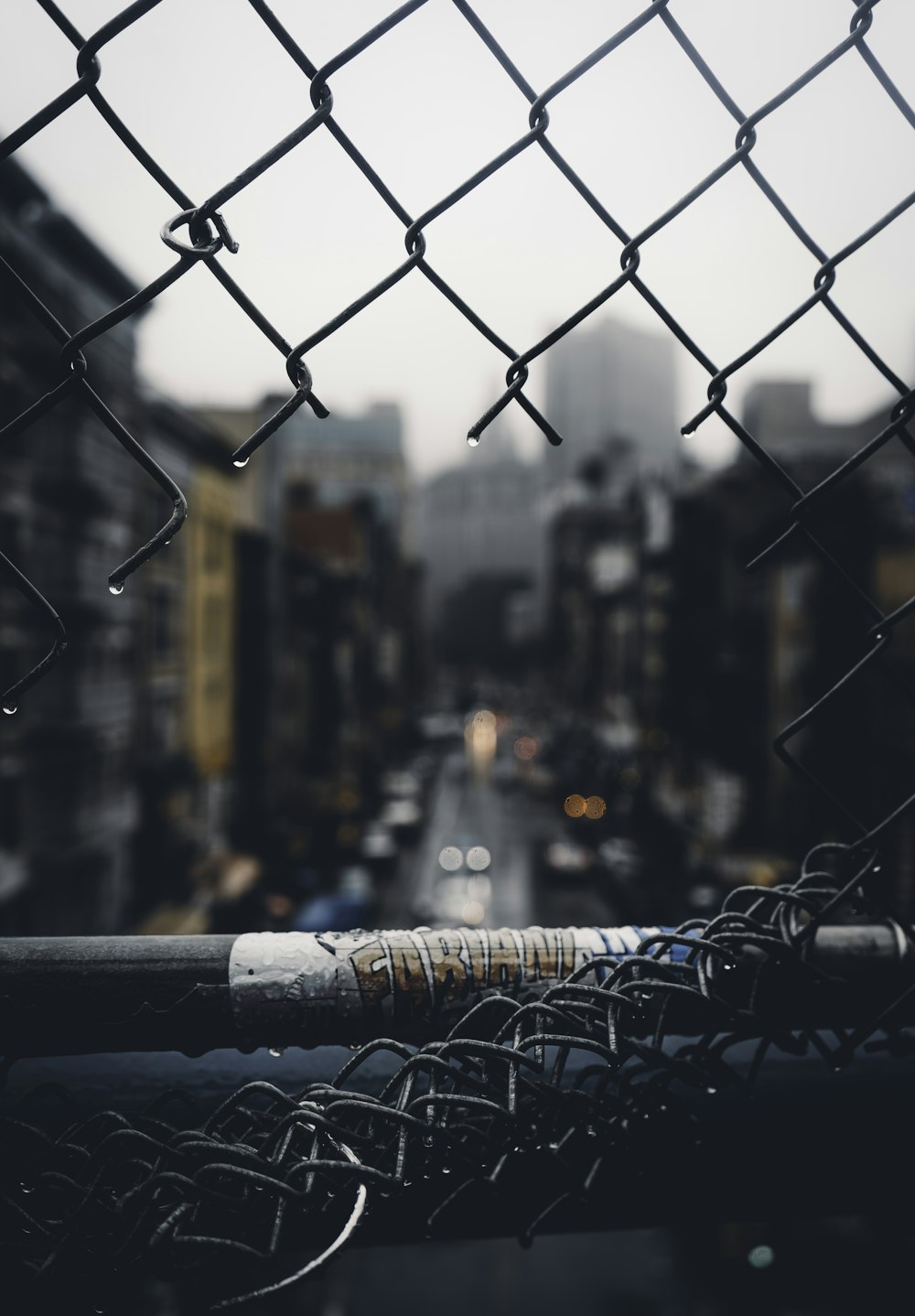 hole cut into wire mesh fence