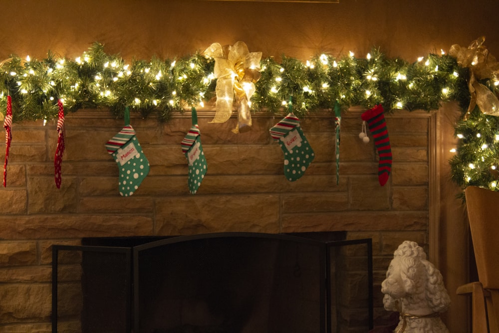 string lights with christmas socks on wall