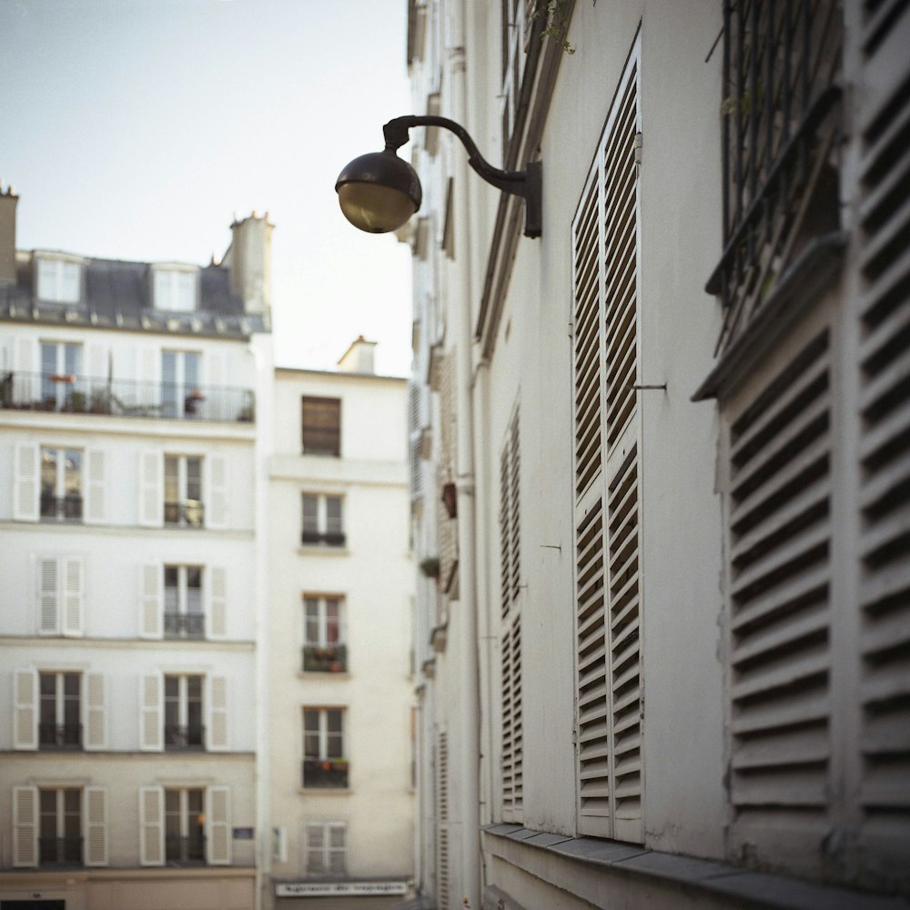 black wall mounted lamp on white building