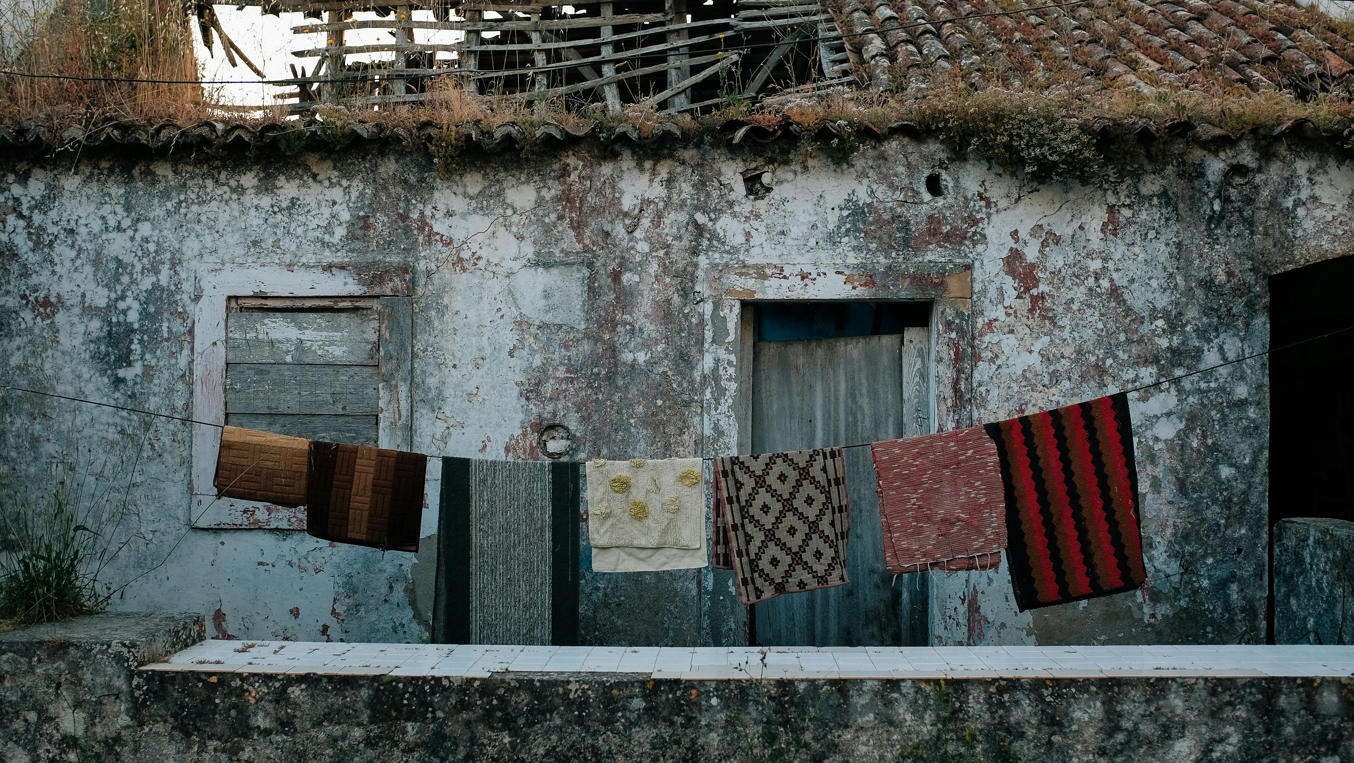 clothes hanged on clothesline outside house