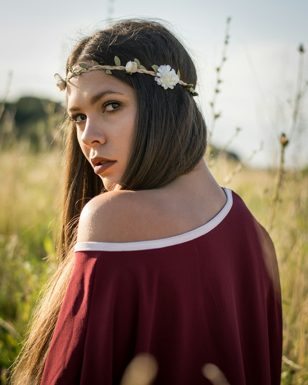 woman standing on the field of grasses