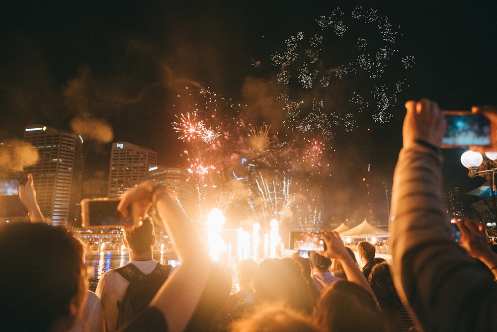 crowd of people watching fireworks