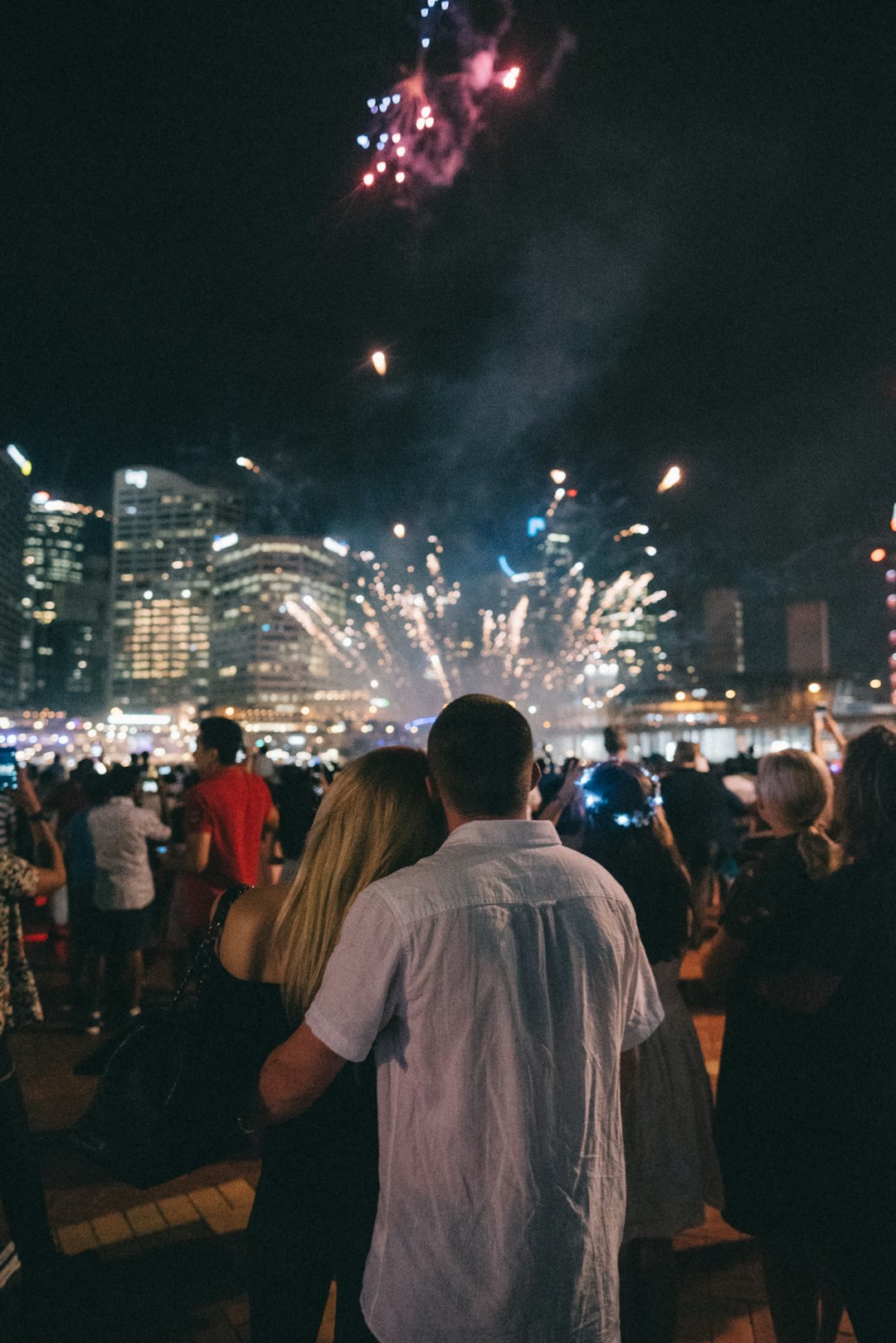 group of people watching fireworks display