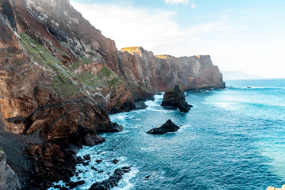 cliff near sea during daytime