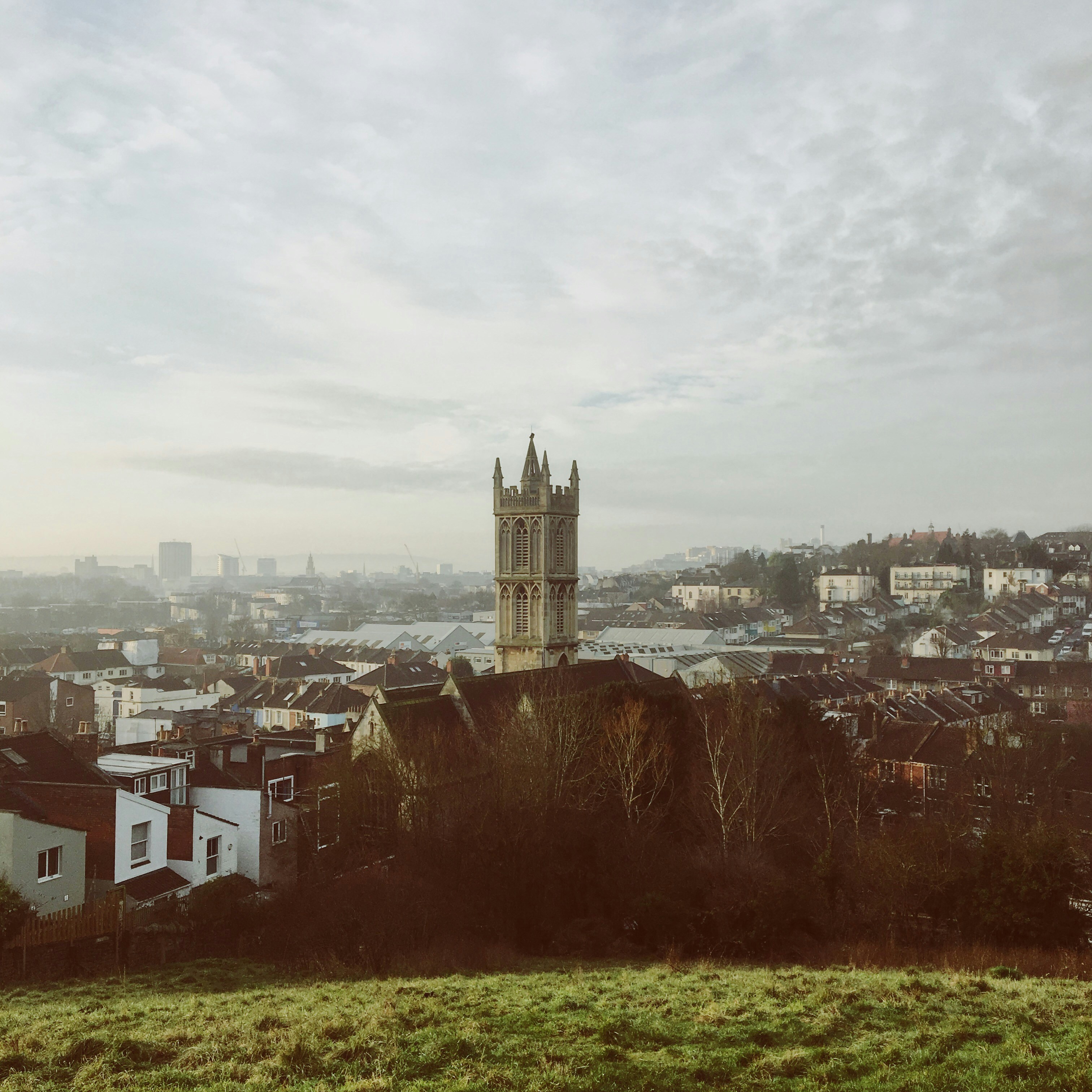 concrete buildings under gray sky during daytime