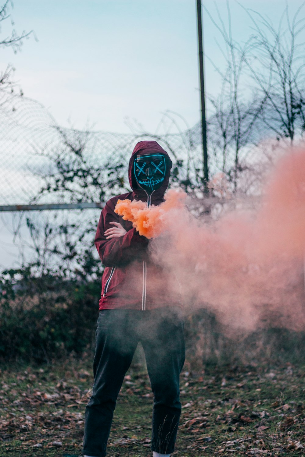 person wearing hoodie and mask