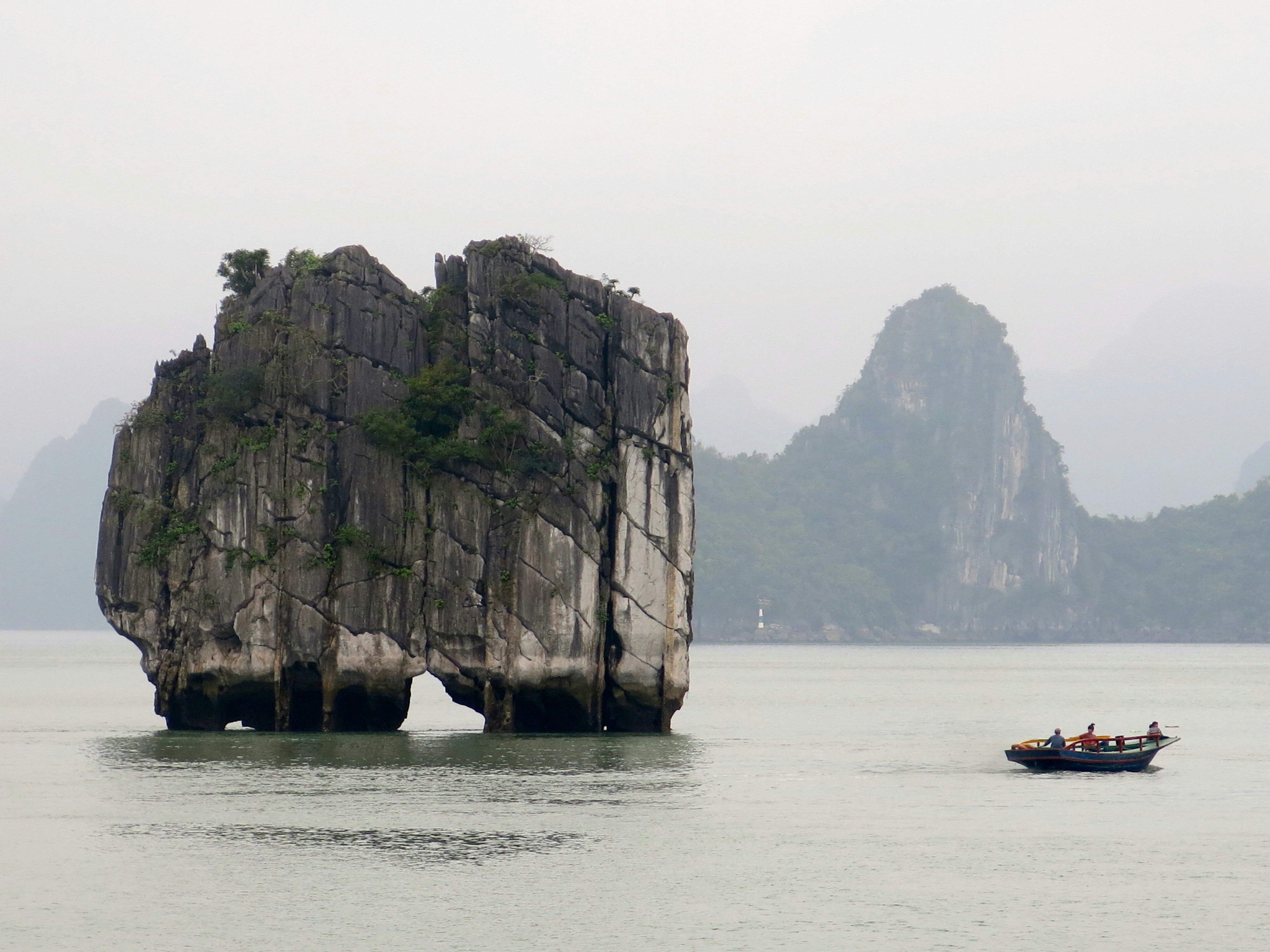 sailing boat near rock mountain at daytime - Ha Long