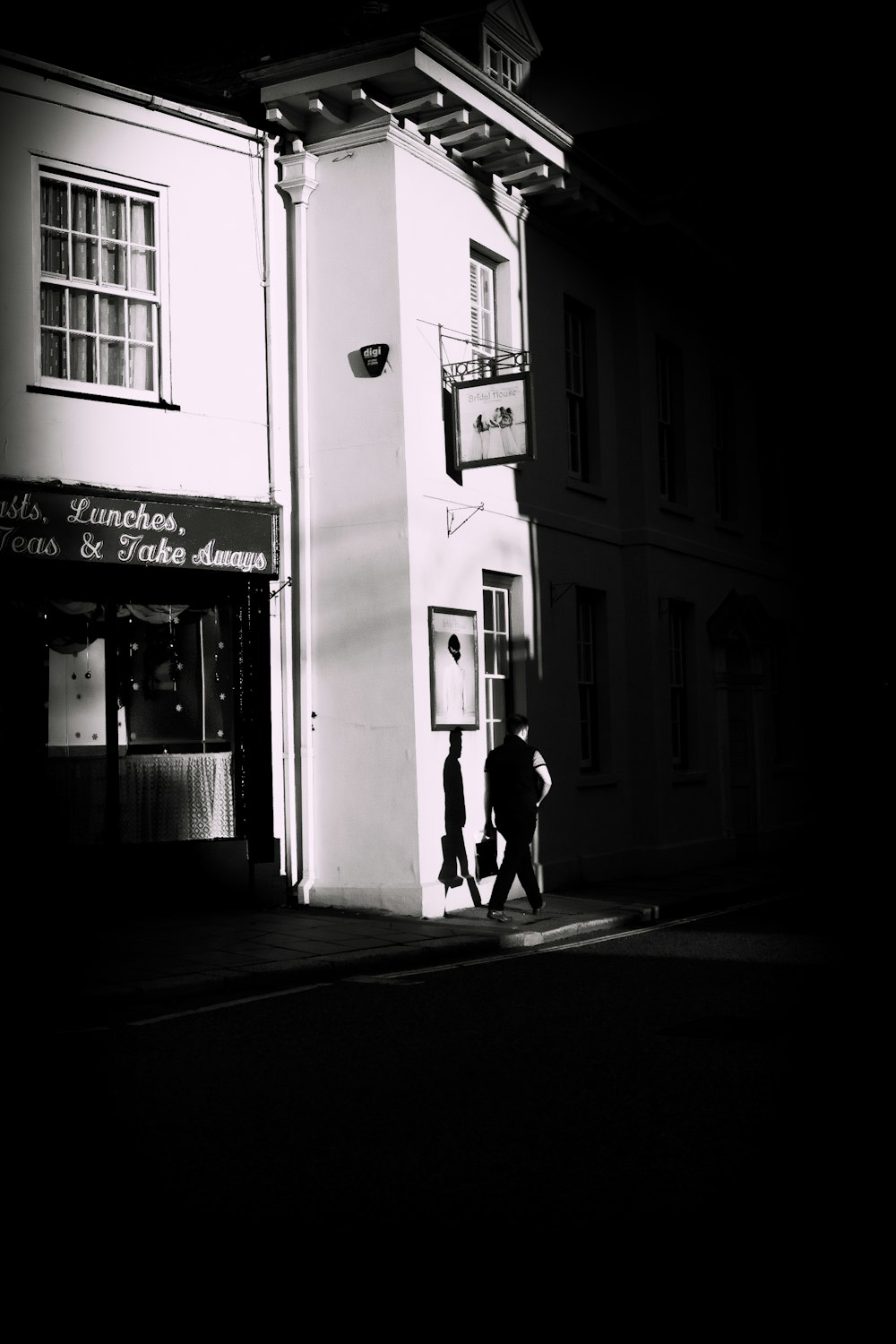 man walking beside road