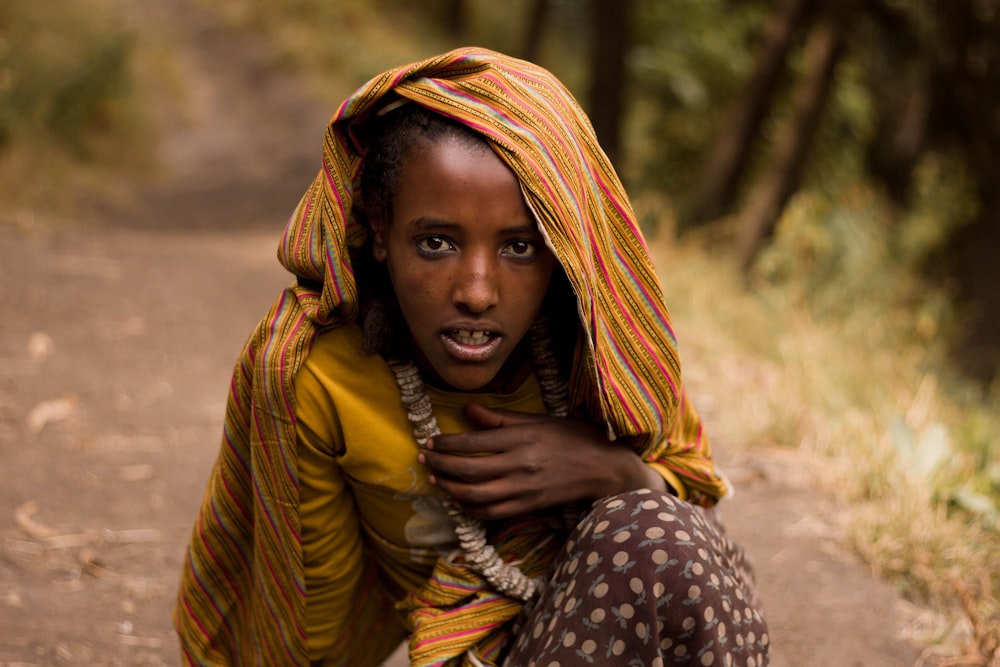 woman sitting on ground