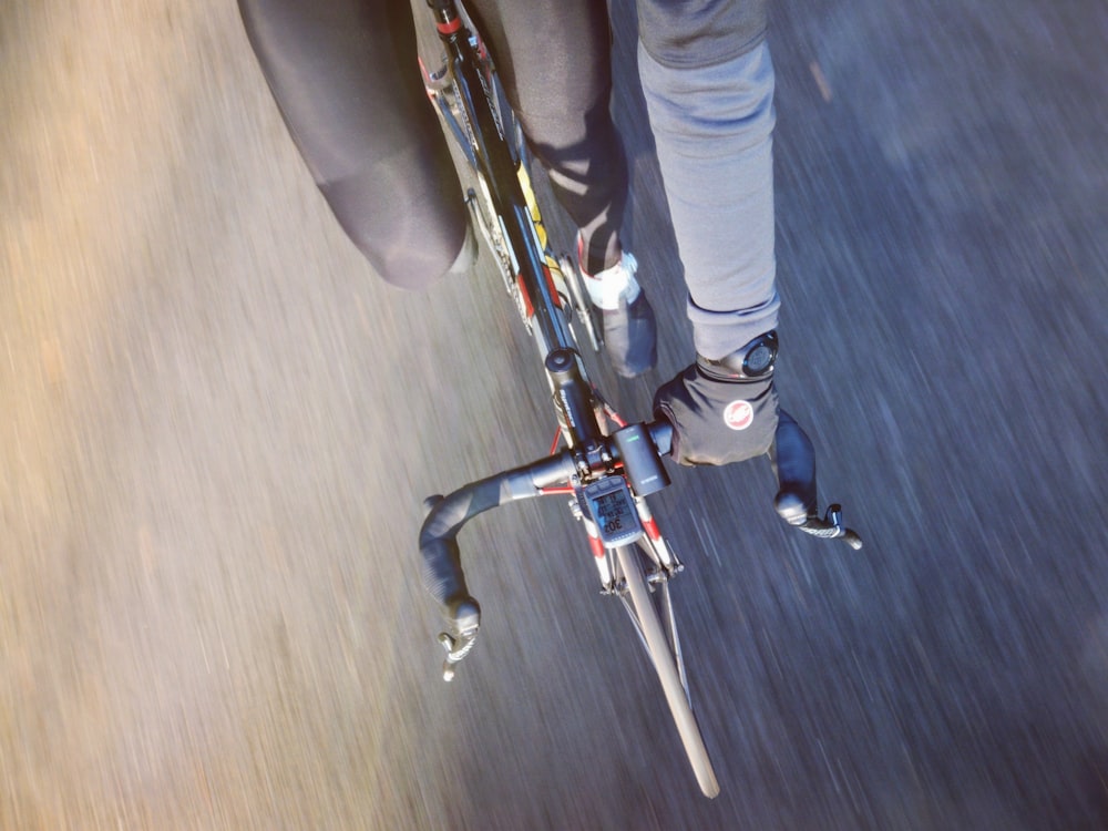 person riding on road bike