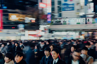 A bustling city street scene captured during a vibrant morning rush hour.