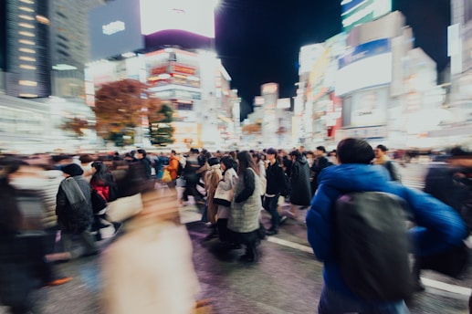 selective focus photography of crowd walking on streets