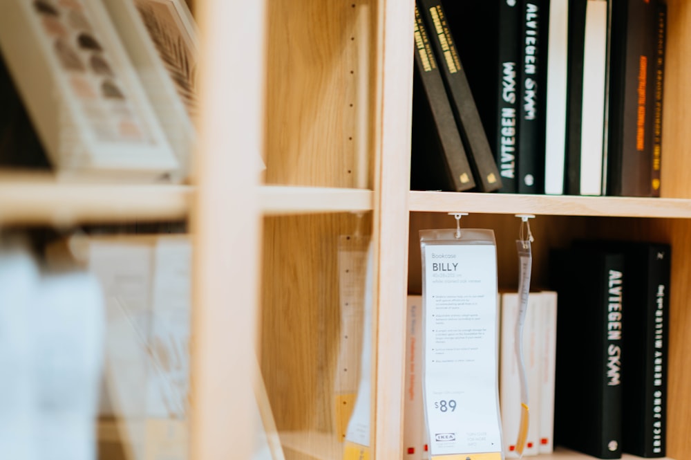 shallow focus photo of books on bookshelf