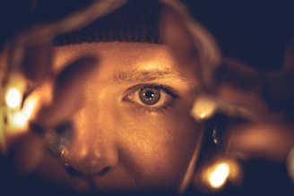 Close-up of Rula in a commercial shoot, her eyes reflecting focus and warmth under studio lights.