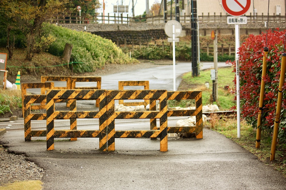 yellow-and-black wooden road barricades