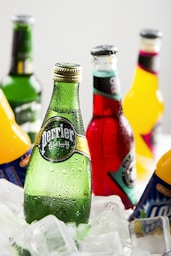several Perrier glass drink bottles