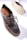 A dark brown leather shoe with detailed stitching and a thick, textured sole is prominently displayed. The shoe features a lace-up design and visible branding on the inner sole. The sole's pattern is visible, showcasing its rugged, slip-resistant design.