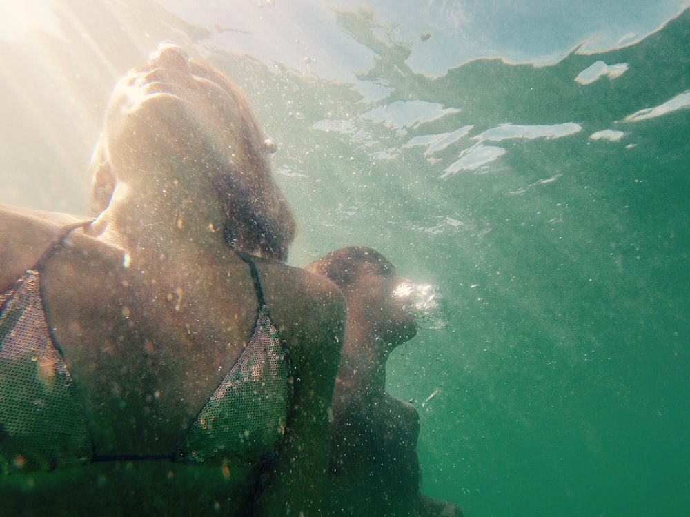 woman diving underwater