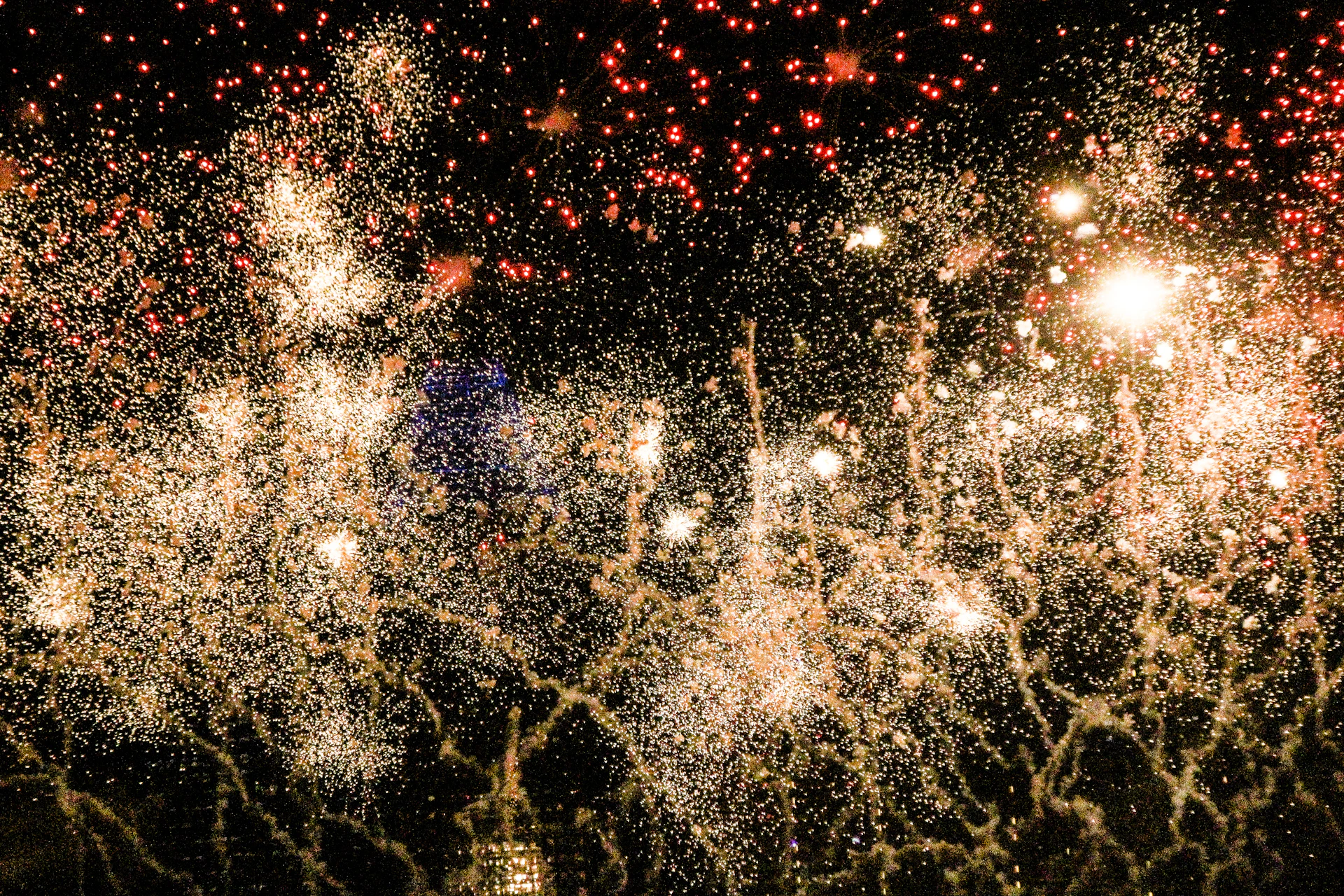 A romantic fireworks display lighting up the night sky with vibrant colors, symbolizing love and celebration.
