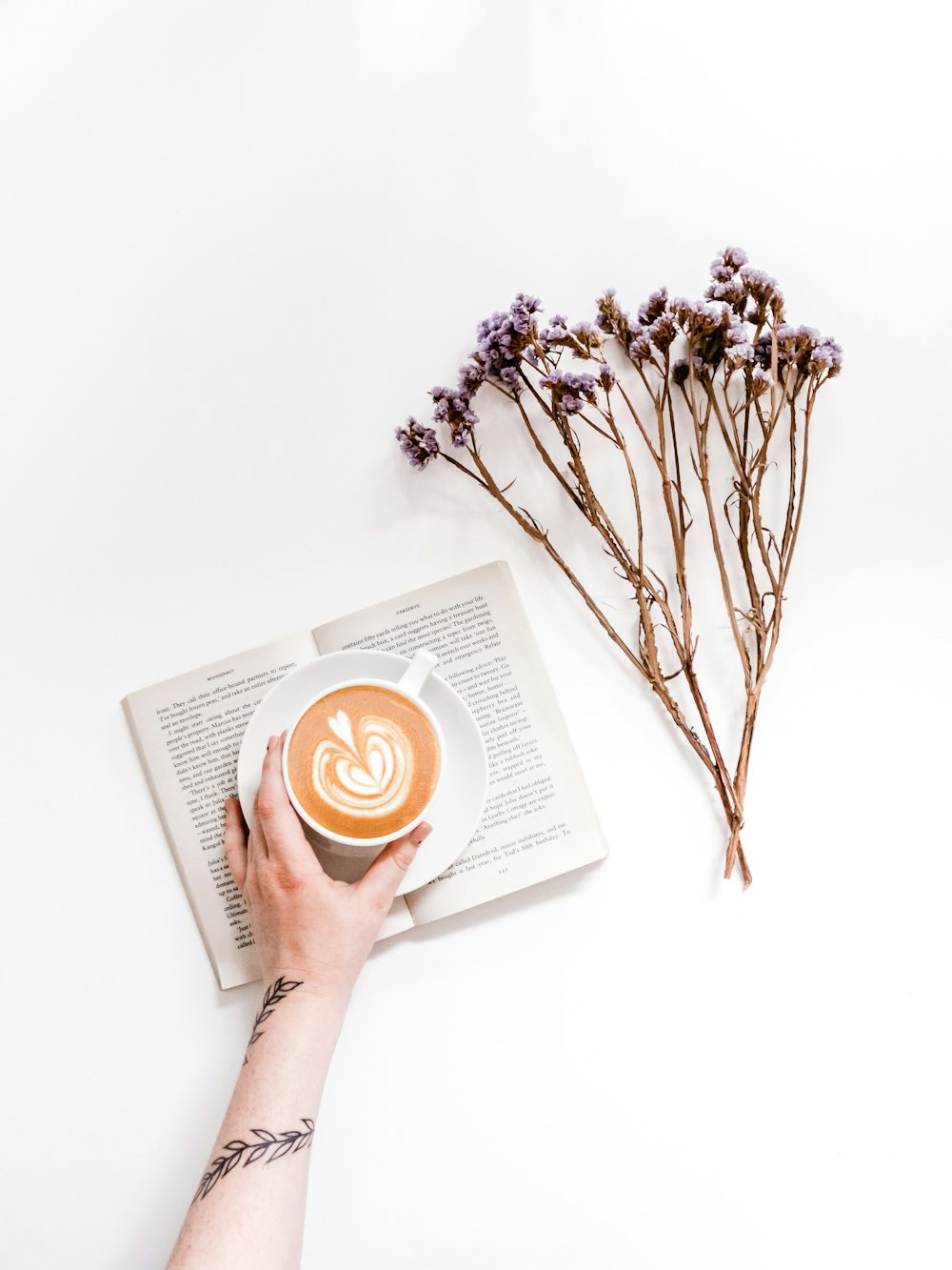 person holding white ceramic mug