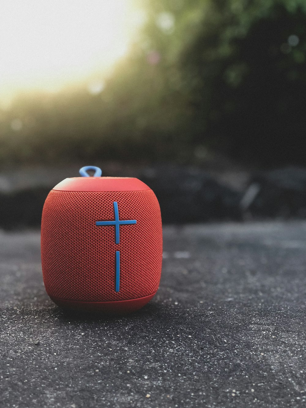 red Ultimate Ears Wonderboom on gray concrete floor