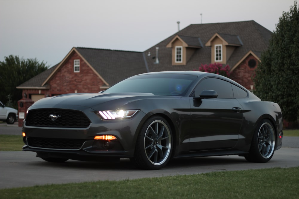black Ford Mustang coupe on road