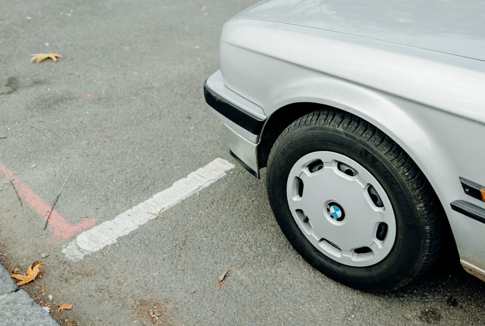 silver BMW vehicle parking during daytime