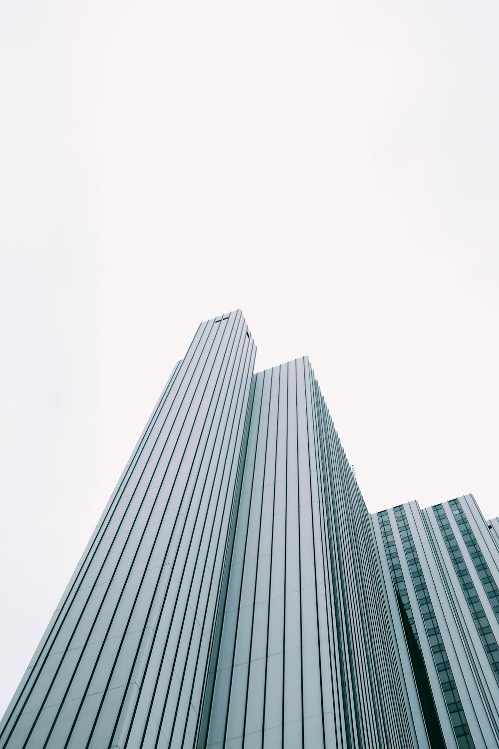 low-angle photography of curtain wall building