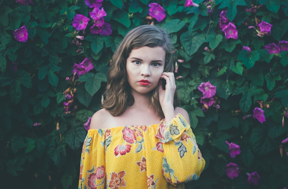 girl near purple-petaled flowers