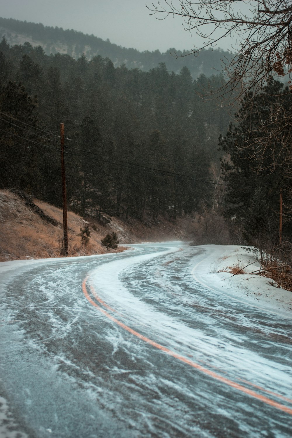 snow-covered asphalt road