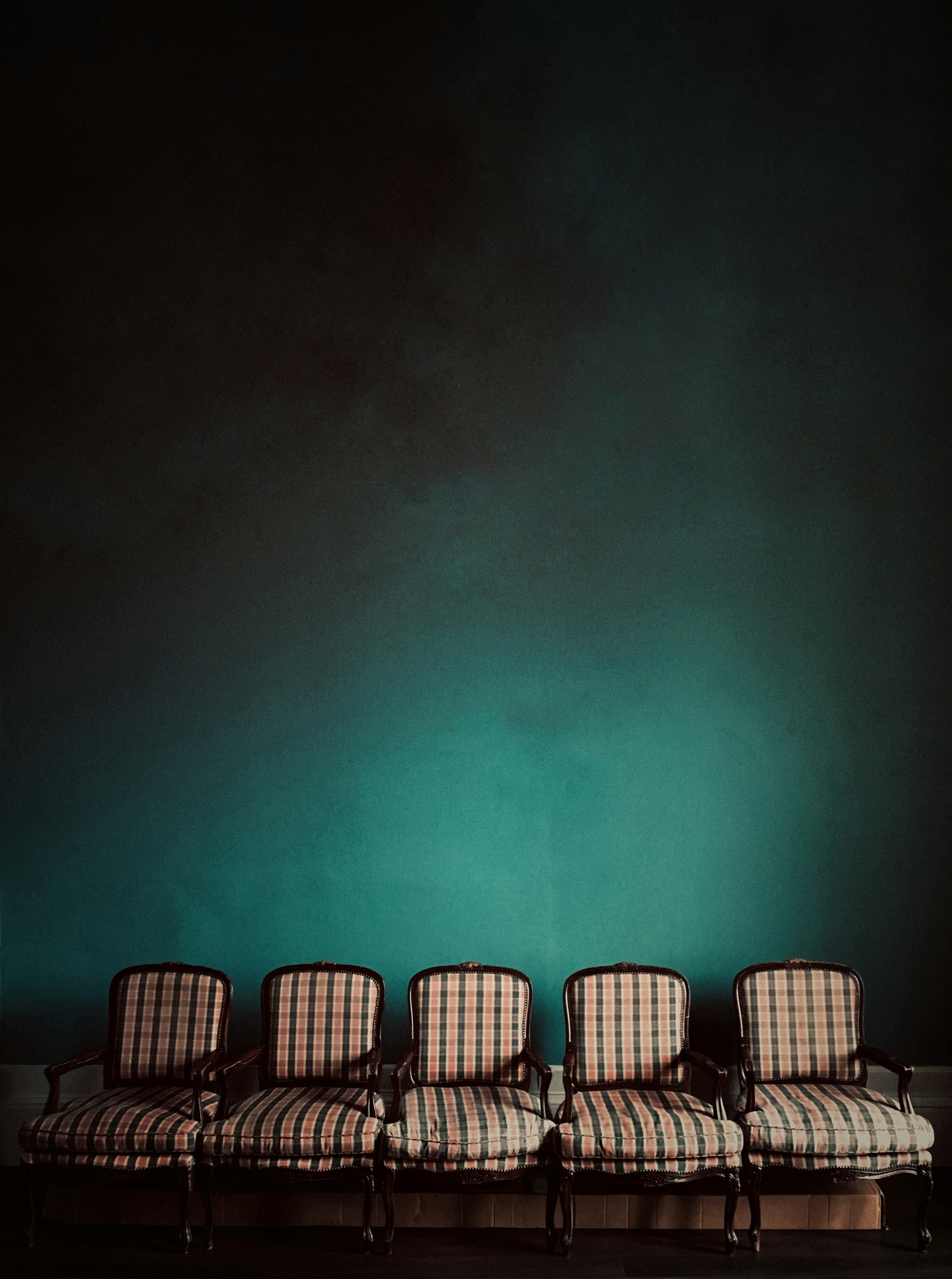 five brown armchairs