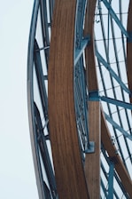Elegant architectural framework showcasing intersecting steel beams with a muted slate blue backdrop.