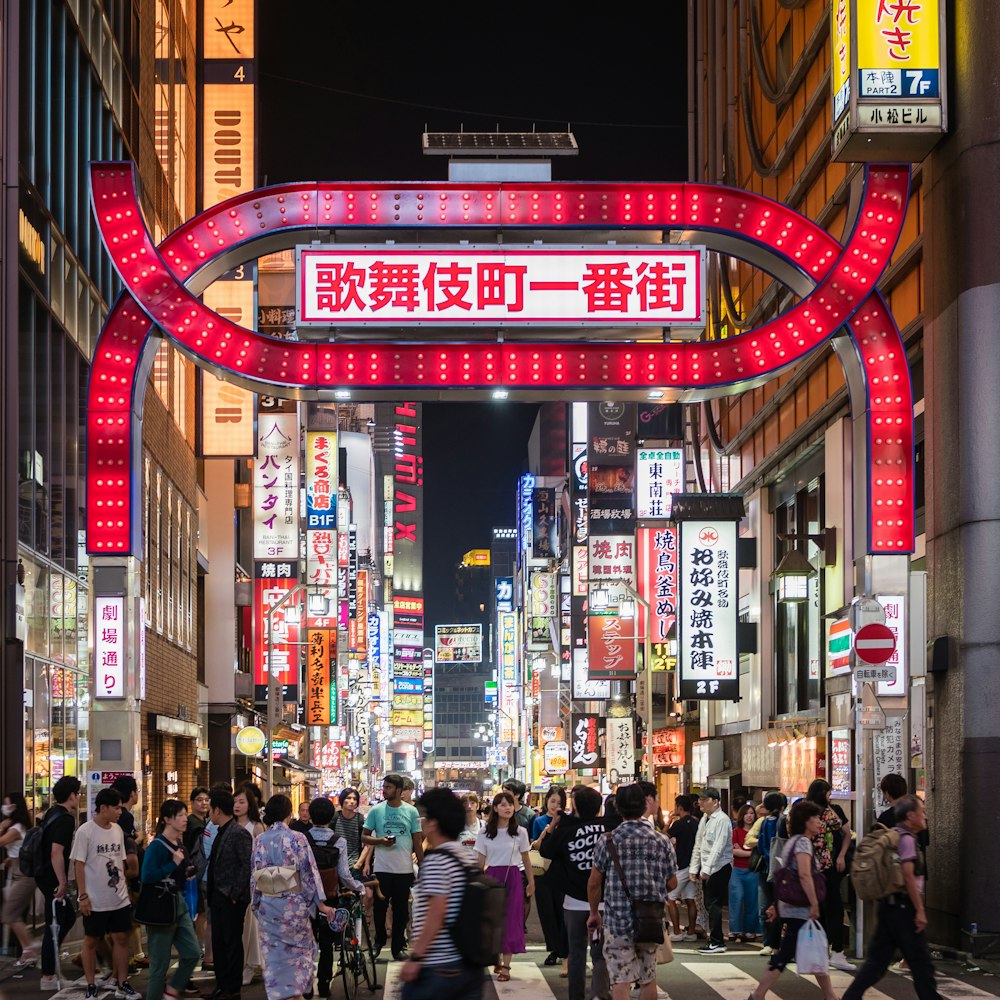 people walking between high-rise buildings