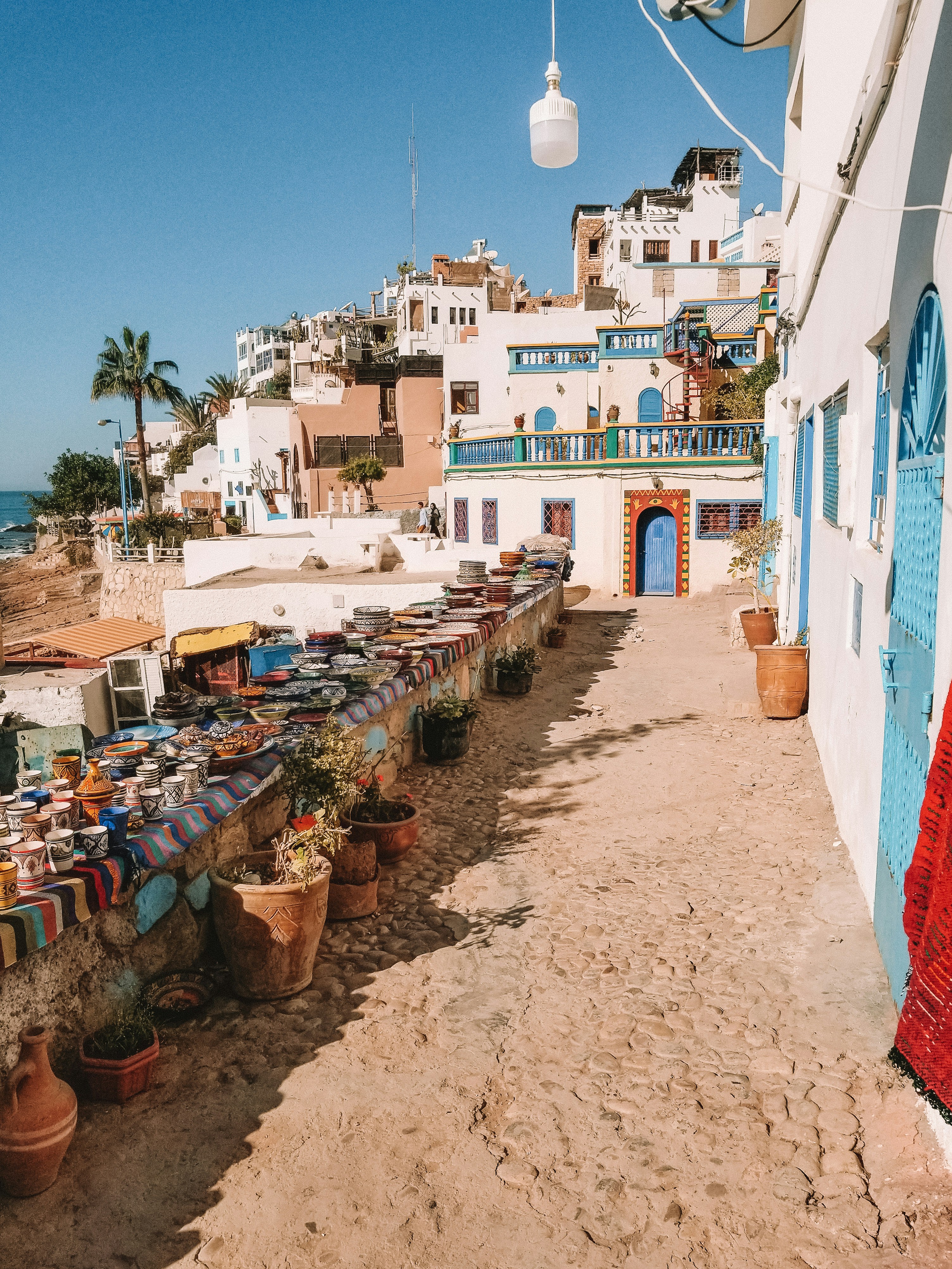 white and brown concrete houses under blue sky during daytime