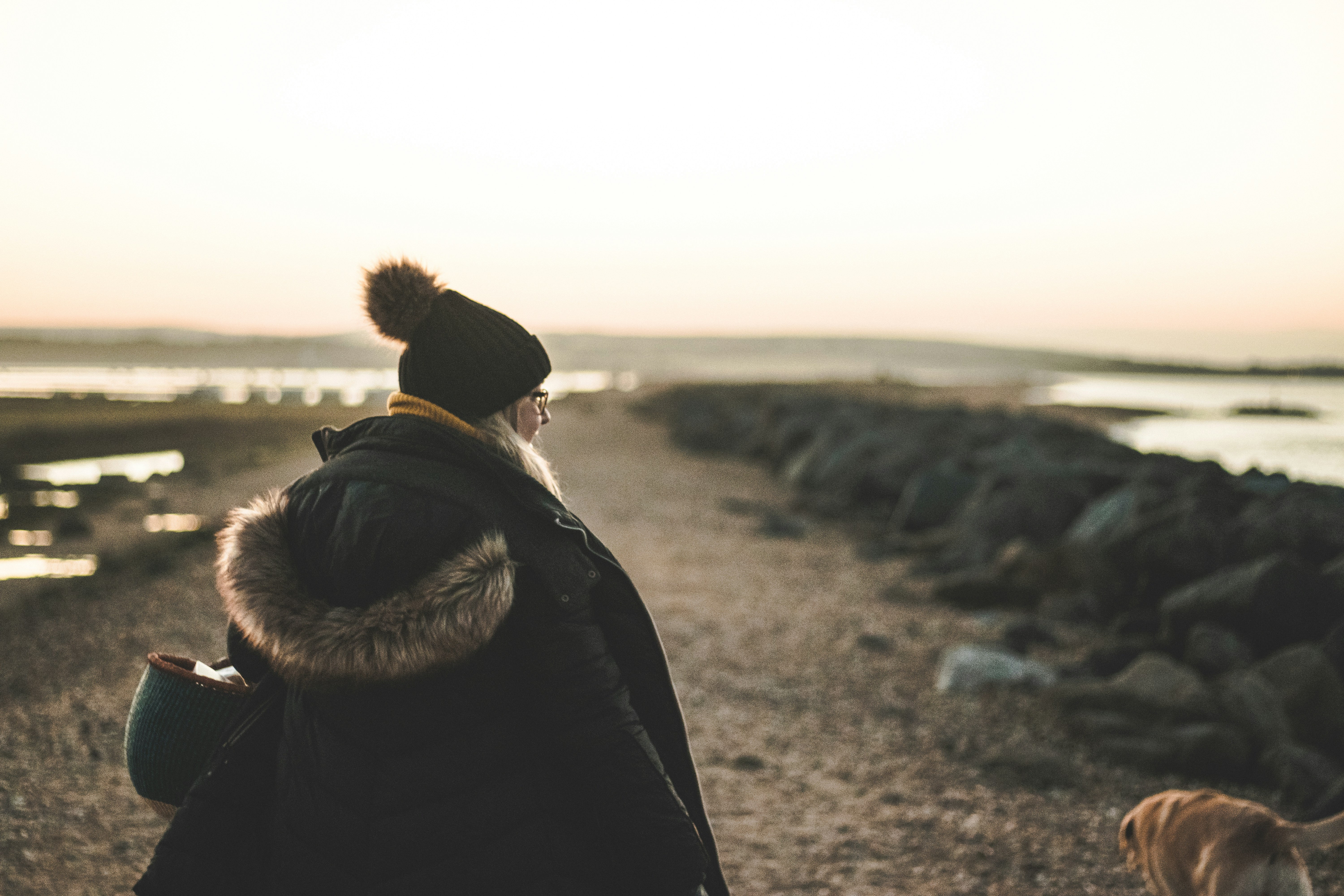woman standing near rocks