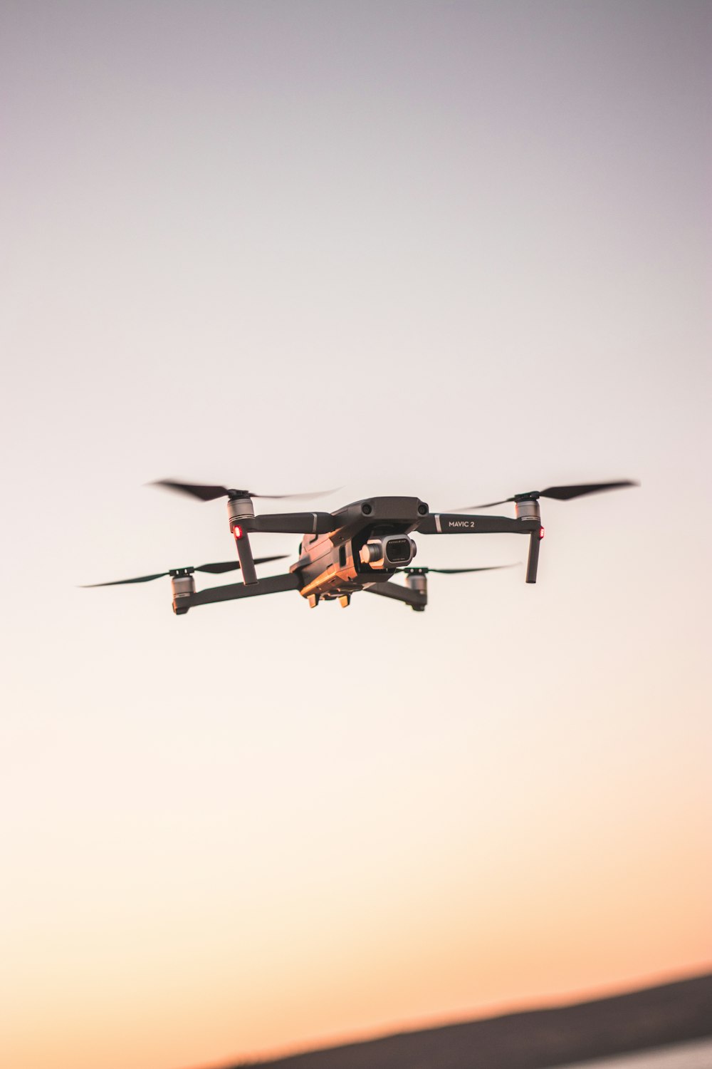 time-lapse photography of quadcopter drone in flight