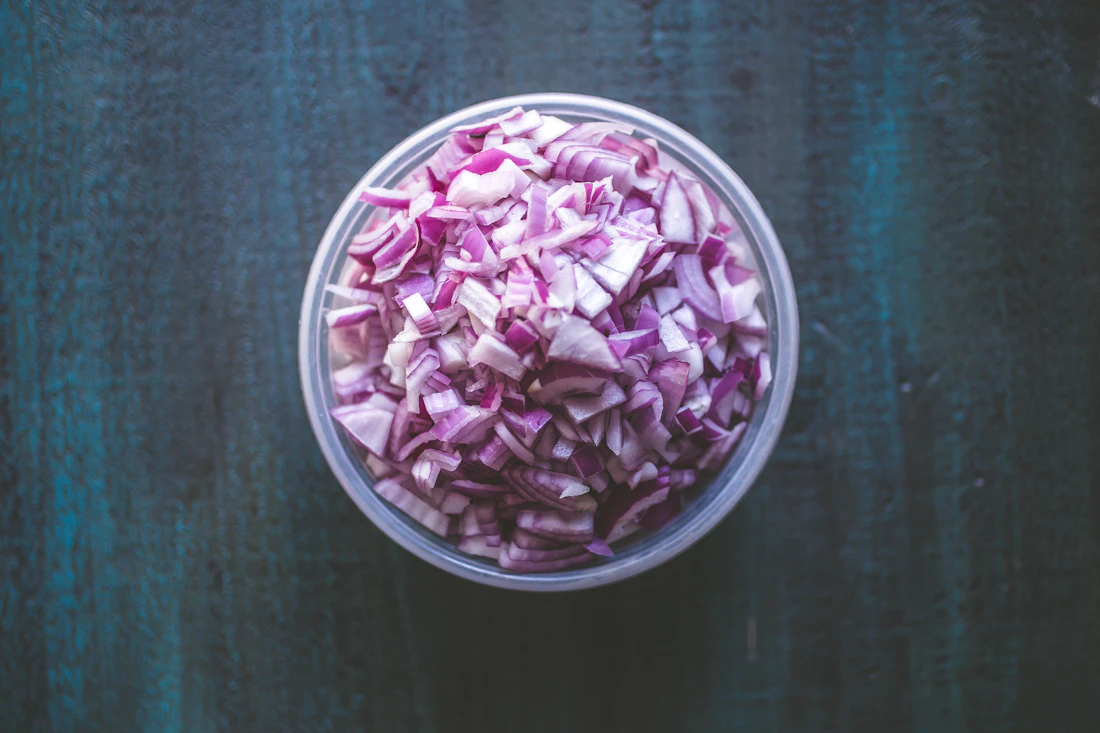 Prepared onion pieces representing processed ingredient supply