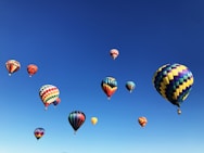 hot air balloons under blue sky during daytime